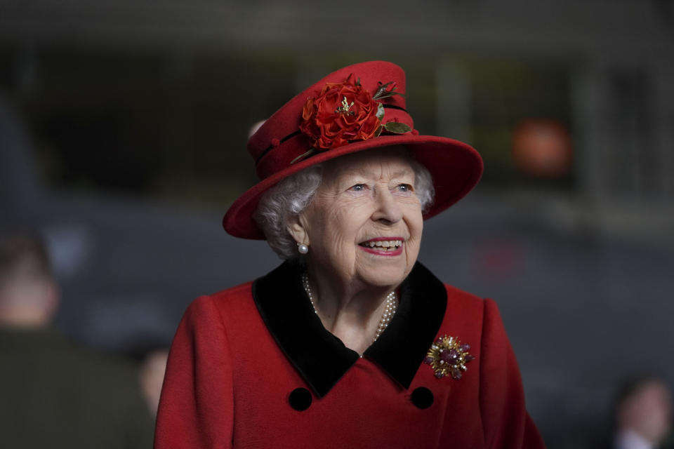 Britain's Queen Elizabeth II visits the HMS Queen Elizabeth at HM Naval Base, ahead of the ship's maiden deployment, in Portsmouth, England, Saturday May 22, 2021. HMS Queen Elizabeth will be leading a 28-week deployment to the Far East that Prime Minister Boris Johnson has insisted is not confrontational towards China. (Steve Parsons/Pool Photo via AP)