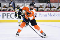 Philadelphia Flyers' Sean Couturier passes the puck during the first period of an NHL hockey game against the Boston Bruins, Tuesday, April 6, 2021, in Philadelphia. (AP Photo/Derik Hamilton)