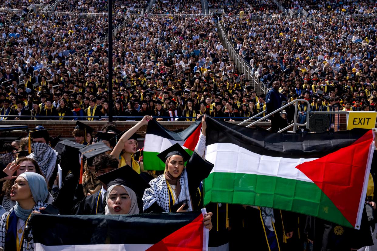 Salma Hamamy, center, holds a Flag of Palestine during a Pro-Palestinian protest during the University of Michigan's spring commencement ceremony (Getty Images)