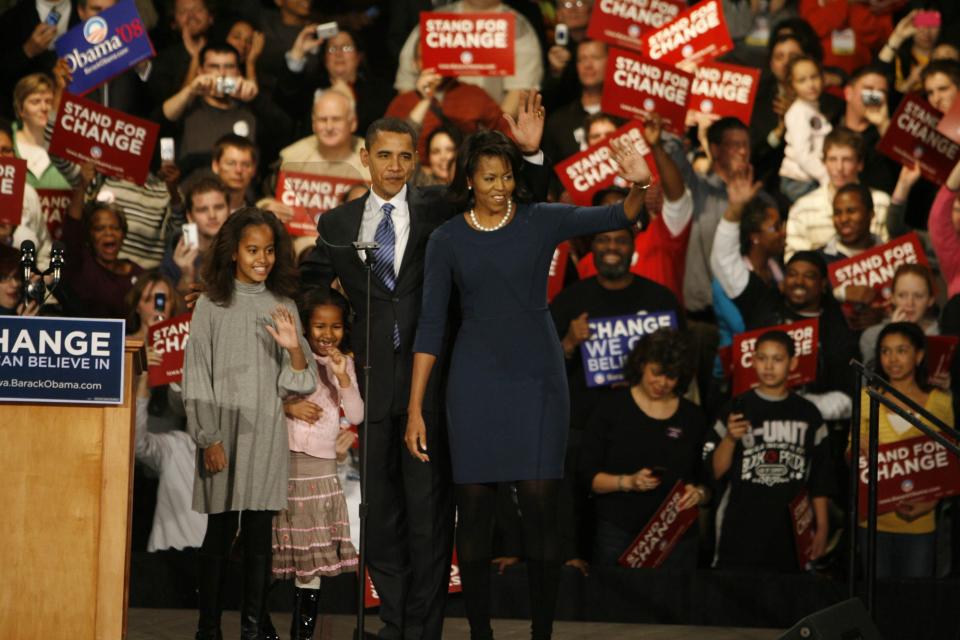 Barack and Michelle Obama and their daughters Malia and Sasha wave to supporters at Hy-Vee Hall in downtown Des Moines on Jan. 3, 2008. Barack Obama won the 2008 Iowa Democratic caucuses.  (Andrea Melendez/The Register)