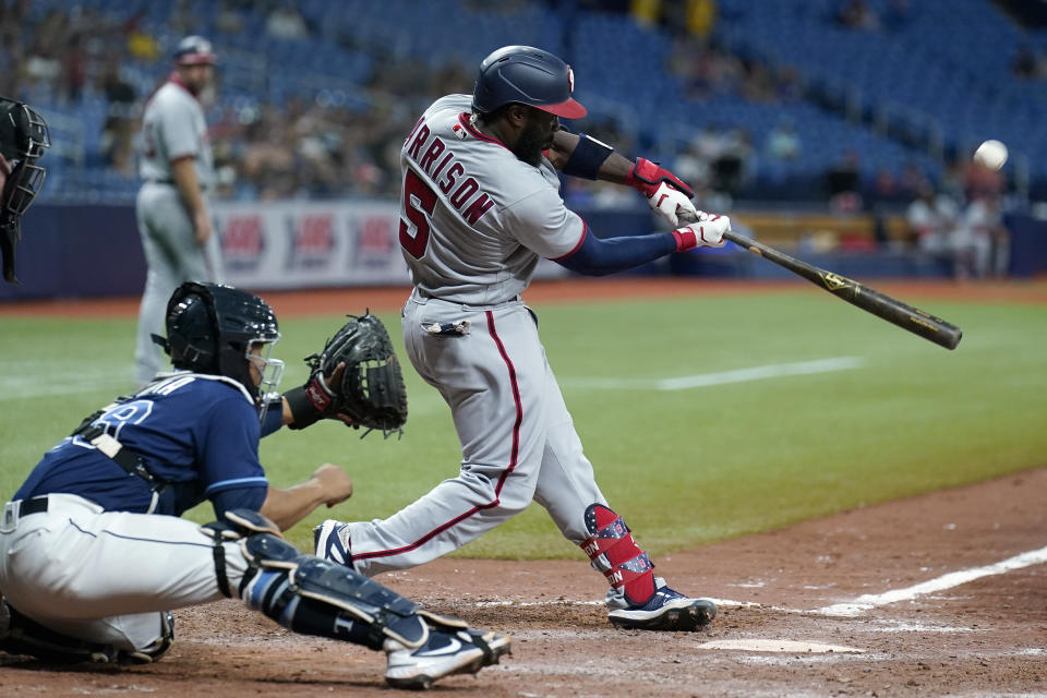 Washington Nationals' Josh Harrison hits a run scoring sacrifice fly off Tampa Bay Rays relief pitcher Diego Castillo during the 11th inning of a baseball game Wednesday, June 9, 2021, in St. Petersburg, Fla. (AP Photo/Chris O'Meara)