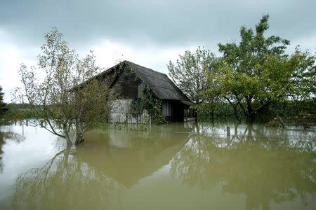 A view of a house in the midst of floodwater in Zazina village, central Croatia, September 15, 2014. REUTERS/Antonio Bronic
