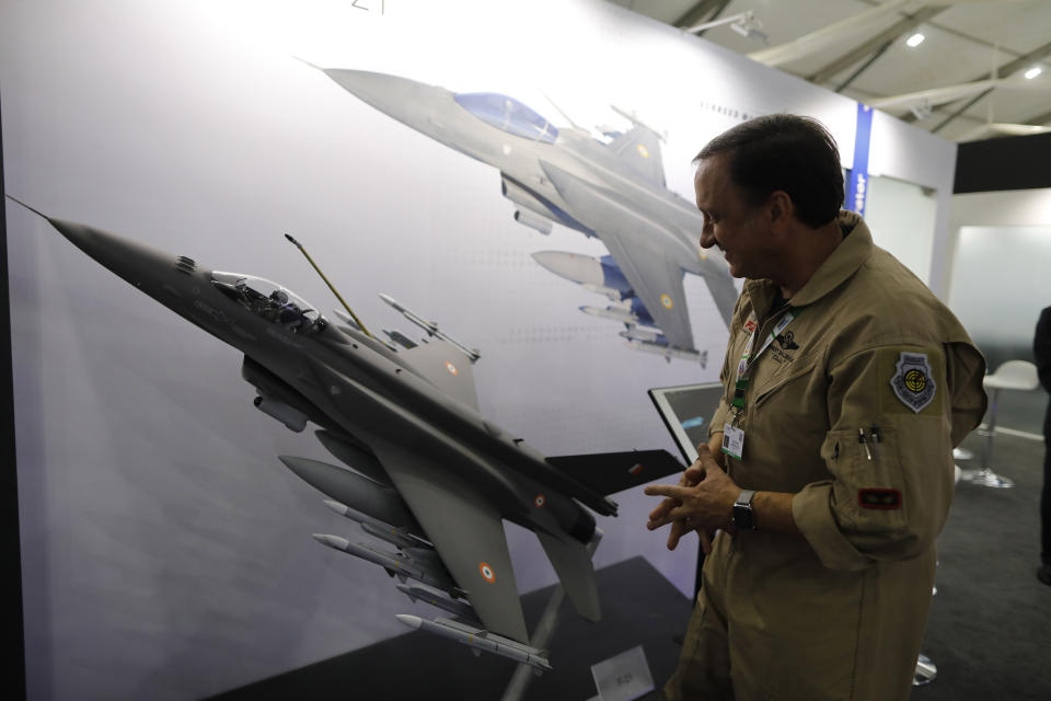 FILE - In this Feb. 5, 2020, file photo, Lockheed Martin's Robert Balserak, Lead Executive, Air Superiority Programs, explains the capabilities of the F-21 at the DefExpo in Lucknow, India. China's government said Monday, Oct. 26, 2020, it will impose sanctions on U.S. military contractors including Boeing Co.'s defense unit and Lockheed Martin Corp. for supplying weapons to rival Taiwan, stepping up a feud with Washington over security and Beijing's strategic ambitions. (AP Photo/Rajesh Kumar Singh, File)