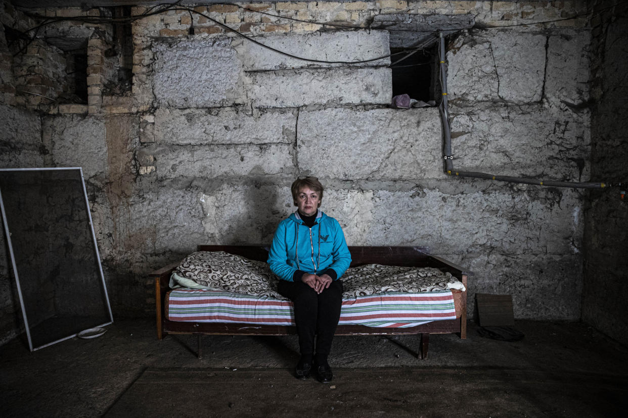 A woman whose house was destroyed in an attack stays in a bomb shelter in Krasnohorivka, in Donetsk Oblast, Ukraine, on Sept. 29, 2022. Residents of the city had to live in bomb shelters due to the ongoing war as power and gas disruption continues.