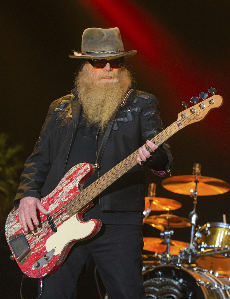 FILE - Dusty Hill of ZZ Top performs during the Stagecoach Festival on April 25, 2015, in Indio, Calif. ZZ Top has announced that Hill, one of the Texas blues trio's bearded figures and bassist, has died at his Houston home. He was 72. In a Facebook post, bandmates Billy Gibbons and Frank Beard revealed Wednesday, July 28, 2021, that Hill had died in his sleep. (Photo by Paul A. Hebert/Invision/AP, File)