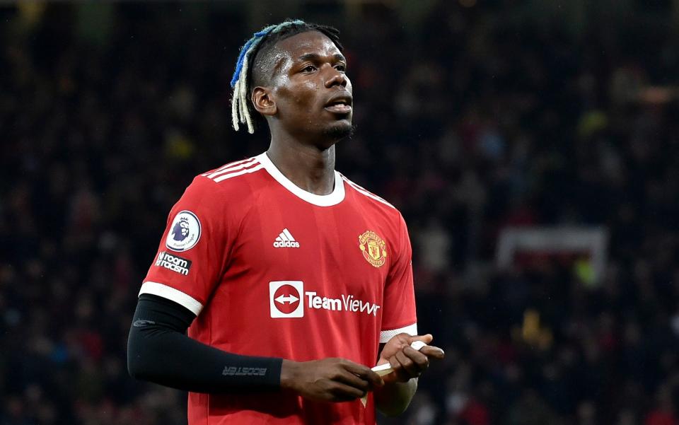 Manchester United's Paul Pogba leaves the pitch after being shown a red card during the English Premier League soccer match between Manchester United and Liverpool at Old Trafford in Manchester, England, Sunday, Oct. 24, 2021. - AP