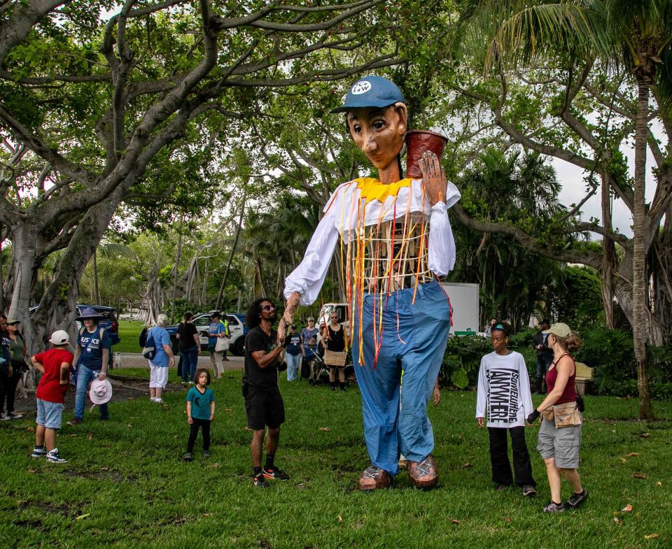 A 16-foot farmworker puppet named Esperanza enters a park across the street from the Palm Beach home of Wendy's board chairman Nelson Peltz on Sunday.