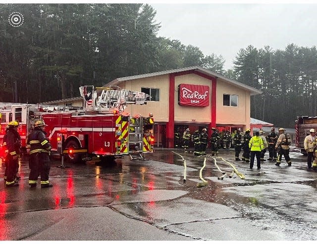 Firefighters at the hotel on Route 146 Wednesday.