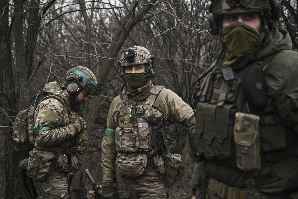 Ukrainian special unit members stands in the woods, near Bachmut, in the region of Donbas, on March 15, 2023.  (Aris Messinis / AFP via Getty Images)