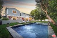 <p>The backyard has a salt-water pool, spa and barbeque pit. (Realtor.com) </p>