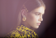 <p>Kaia Gerber shows off her accessories backstage at Versace. <em>[Photo: Versace]</em> </p>