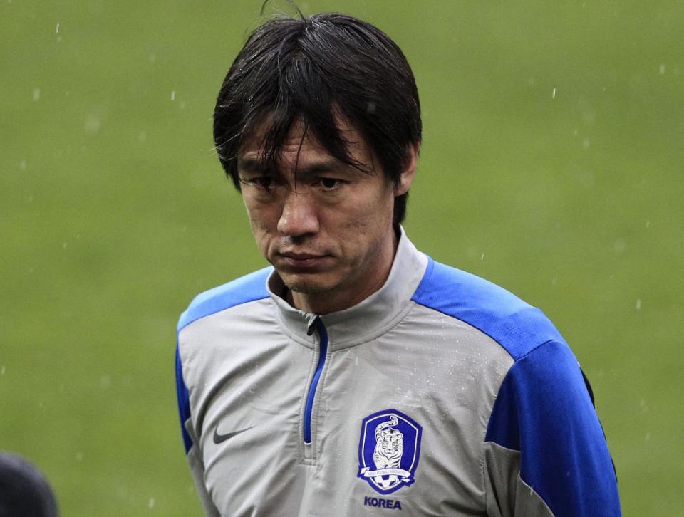 FILE - In this March 4, 2014 file photo, South Korea's coach Hong Myung-bo watches his players during a training session at Georgios Karaiskakis stadium in Piraeus port, near Athens. The second round of the Asian Champions League takes on extra emphasis for some World Cup hopefuls this week, with South Korea’s Hong Myong-bo among the national team coaches carefully watching the continental club competition before announcing his squad for Brazil 2014.(AP Photo/Thanassis Stavrakis, File)