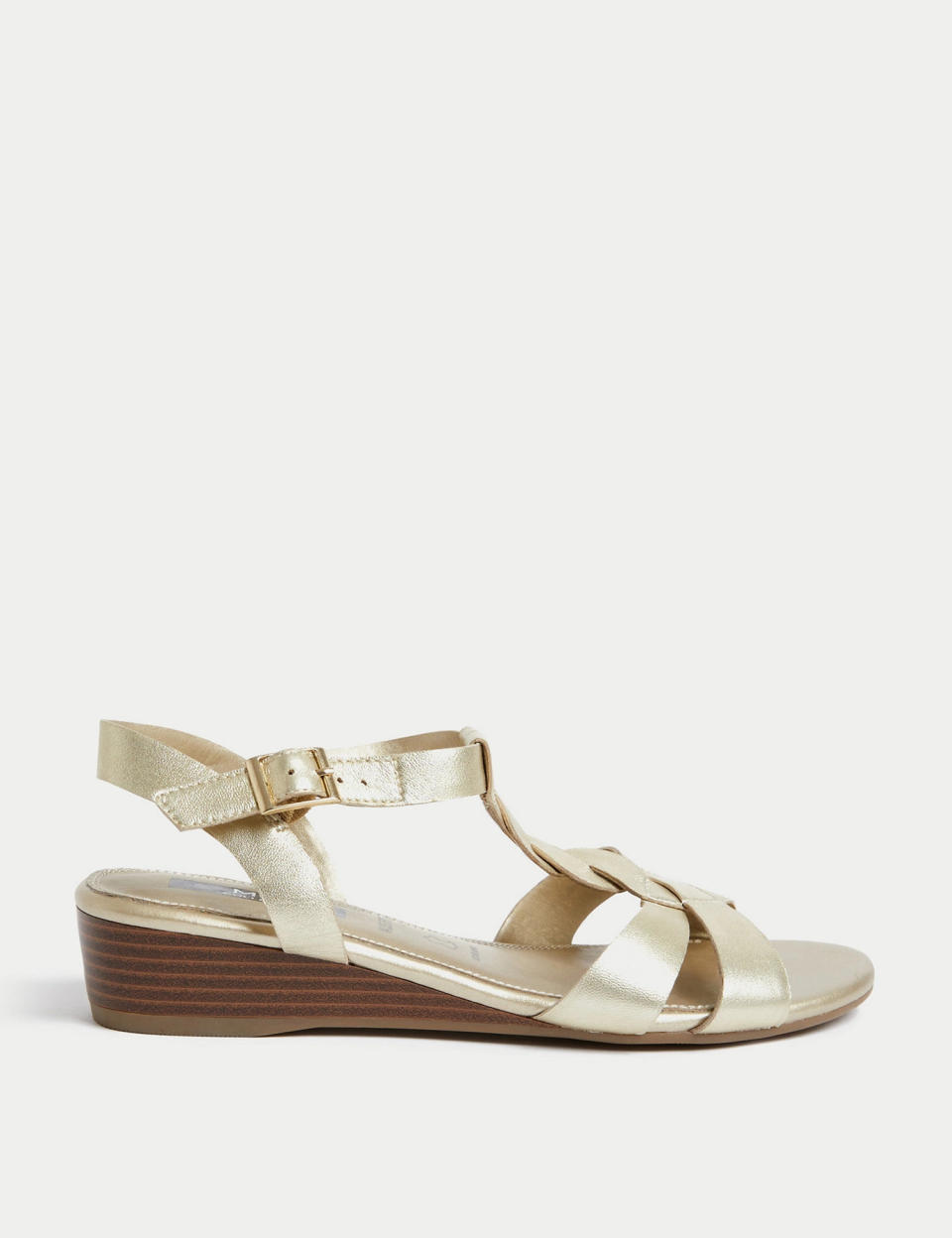 This luxe-looking gold leather pair have the cutest little wedge for a little lift. (Marks & Spencer)