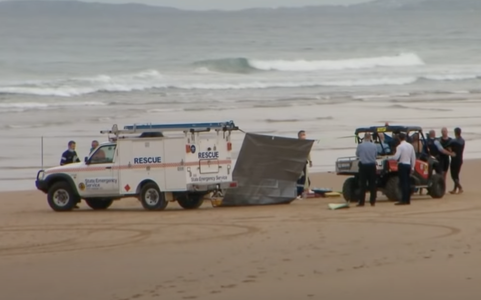 Paramedics and police at Shelly Beach after a man was mauled by a shark.