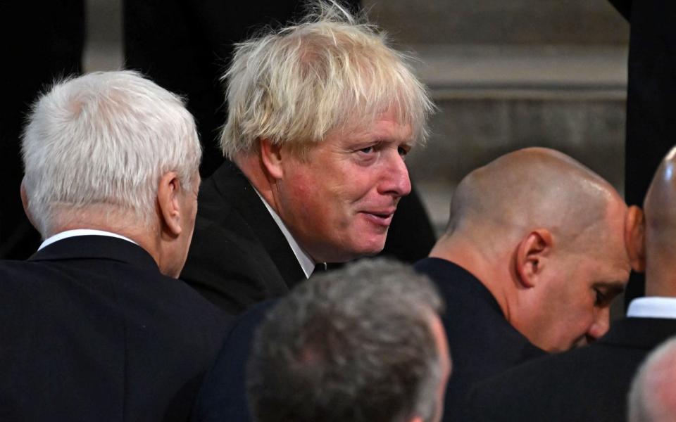 Former Prime Minister Boris Johnson awaits the arrival of the King - Ben Stansall/AFP