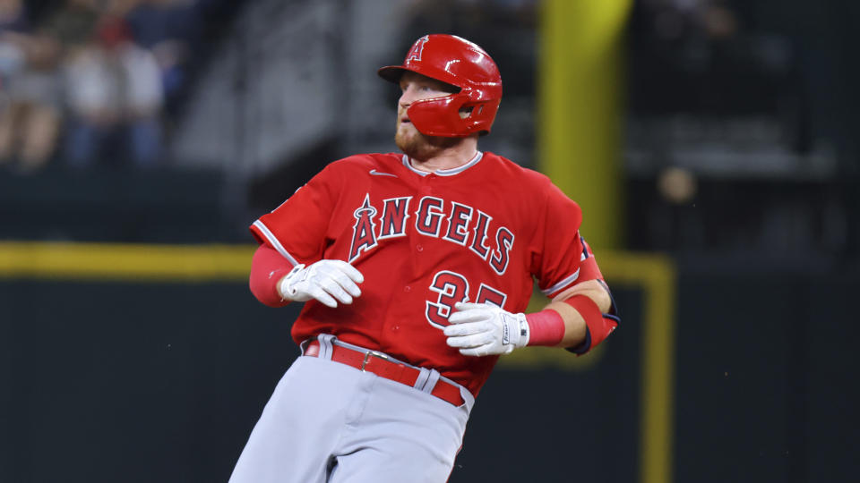 Los Angeles Angels' Chad Wallach holds up after rounding second after hitting for a double in the third inning of a baseball game against the Texas Rangers, Tuesday, June 13, 2023, in Arlington, Texas. (AP Photo/Gareth Patterson)