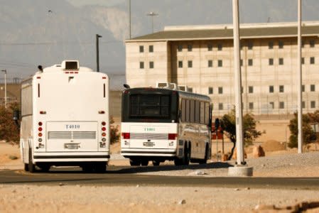 FILE PHOTO: Immigration and Customs Enforcement (ICE) detainees arrive at FCI Victorville federal prison in Victorville, California, U.S. June 8, 2018. REUTERS/Patrick T. Fallon/File Photo