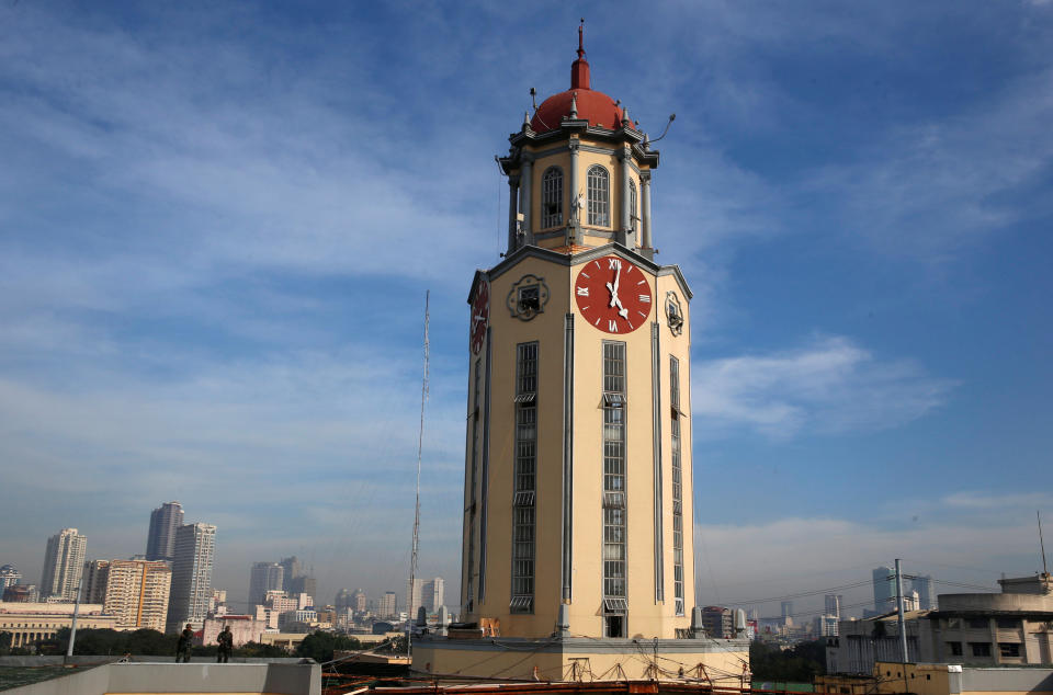 The clock tower of the Manila City Hall with the city skyline on the background in Manila, Philippines. (Photo: REUTERS/Erik De Castro)