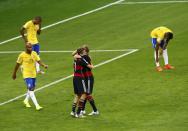 Germany's Thomas Mueller and Toni Kroos celebrate their team's second goal against Brazil during their 2014 World Cup semi-finals at the Mineirao stadium in Belo Horizonte July 8, 2014. REUTERS/Leonhard Foeger