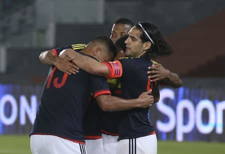 Radamel Falco (R) of Colombia celebrates his goal with teammates during their international friendly soccer match against Kuwait in Abu Dhabi March 30, 2015. REUTERS/Stringer