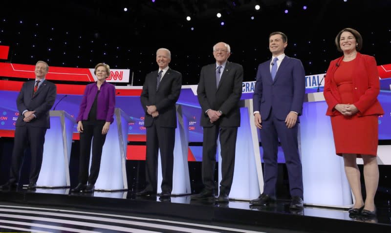 Democratic 2020 U.S. presidential candidates Tom Steyer, Elizabeth Warren, Joe Biden, Bernie Sanders, Pete Buttigieg and Amy Klobuchar take the stage for the seventh Democratic 2020 presidential debate in Des Moines