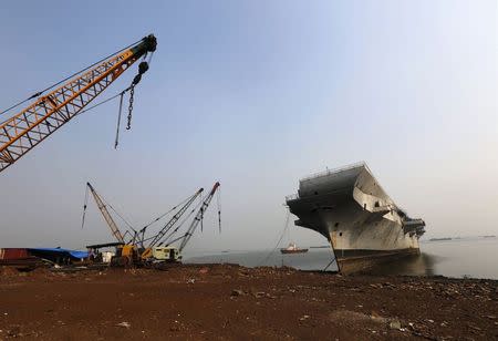 Decommissioned Indian Navy Ship INS Vikrant is pictured at a ship breaking yard in Mumbai November 17, 2014. REUTERS/Shailesh Andrade