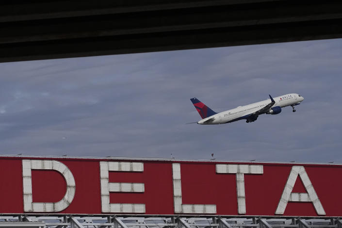 FILE - A Delta Air Lines plane takes off from Hartsfield-Jackson Atlanta International Airport in Atlanta, Nov. 22, 2022. Delta announced Thursday, Jan. 5, 2023, that it will provide free Wi-Fi service on most of its U.S. flights starting in February. (AP Photo/Brynn Anderson, File)
