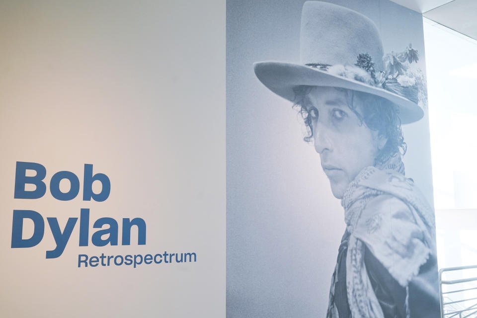 The entrance to "Restrospectrum", an exhibit of Bob Dylan's visual art at Florida International University, Tuesday, Nov. 23, 2021, in Miami. The exhibit showcasing more than 180 acrylics, watercolors, drawings and ironwork sculptures, will be on display at the Patricia and Phillip Frost Art Museum. (AP Photo/Marta Lavandier)