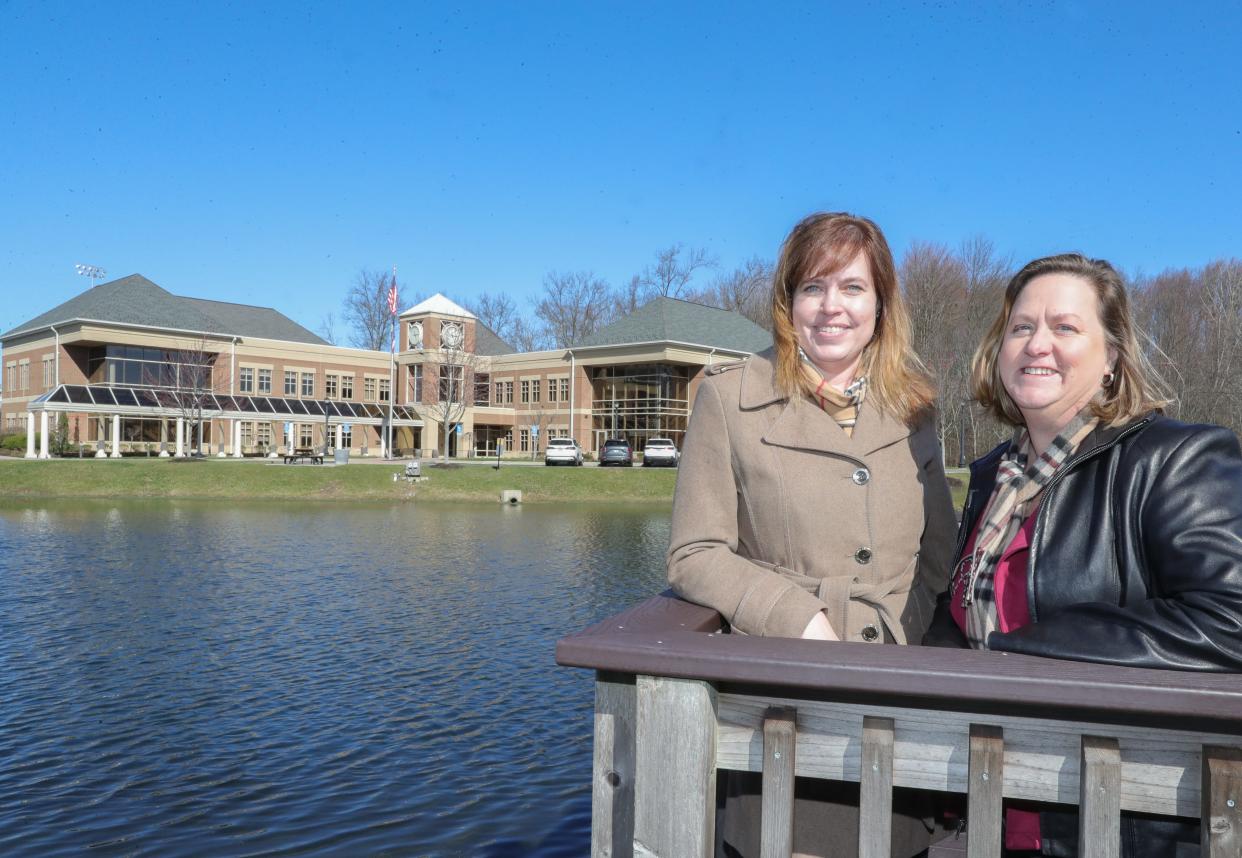 City of Green Deputy Public Service Director Chrissy Lingenfelter, left, and Public Service Director Valerie Wax Carr stand in front of the city's public administration building. Carr said their public service roles are traditionally held by men but are increasingly coming under the direction of women.