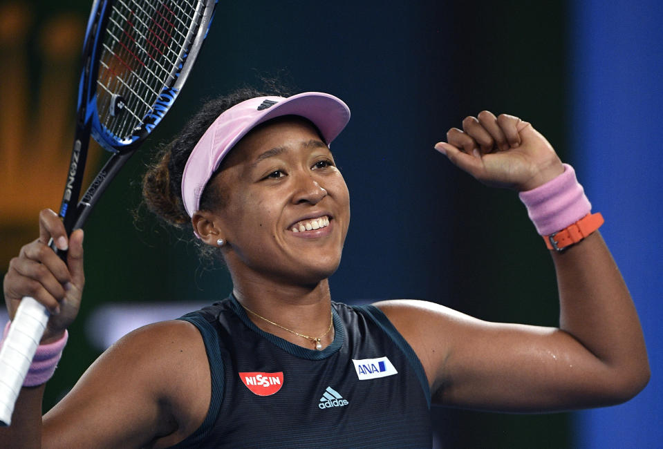 Japan's Naomi Osaka celebrates after defeating Karolina Pliskova of the Czech Republic in their semifinal at the Australian Open tennis championships in Melbourne, Australia, Thursday, Jan. 24, 2019. (AP Photo/Andy Brownbill)