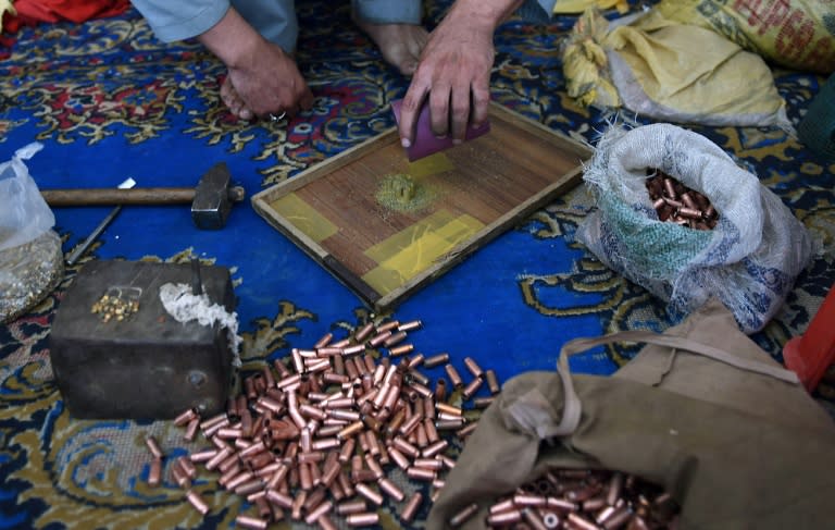 Pakistani gunsmiths assemble bullets at a small workshop in the tribal area of Darra Adamkhel