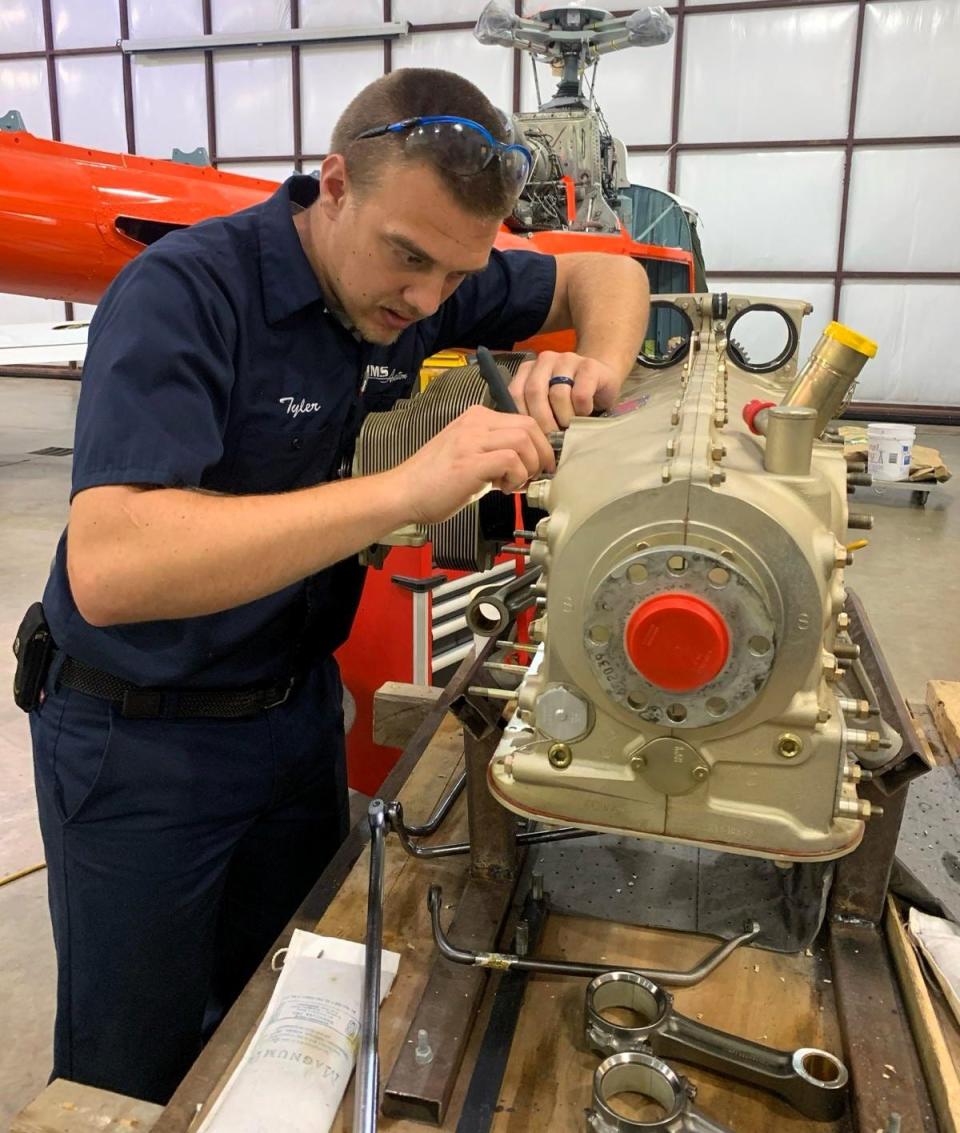 Tyler Sensenig works on an engine at MMS Aviation.