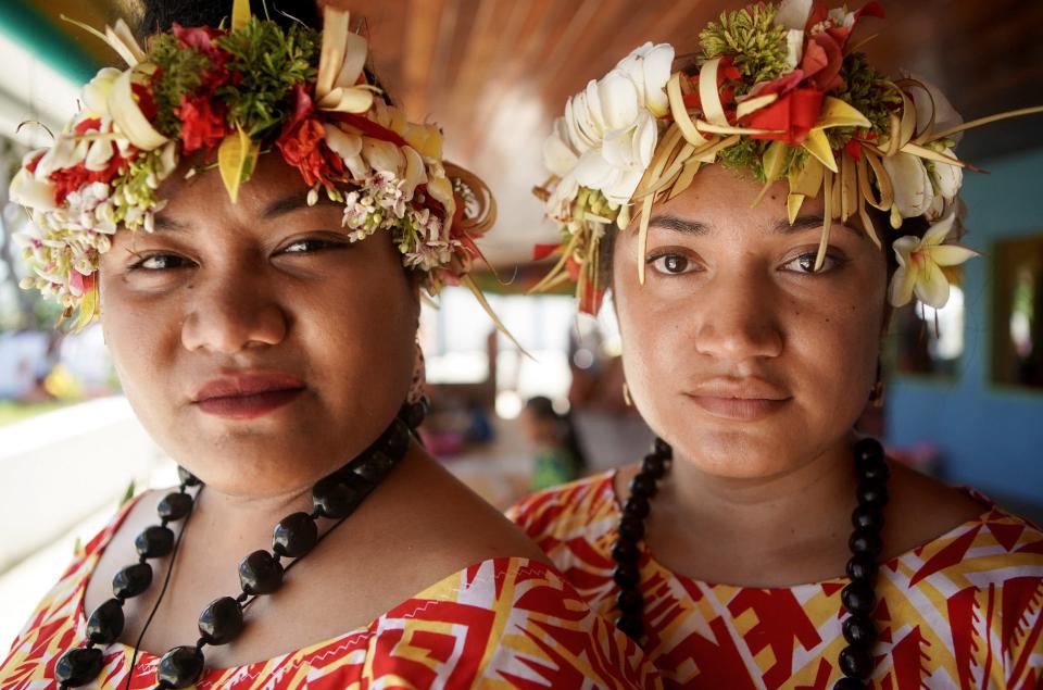 Faitau Teikausi (R) and Pasepa Afele pose at a traditional community celebration on November 25, 2019 in Funafuti, Tuvalu.