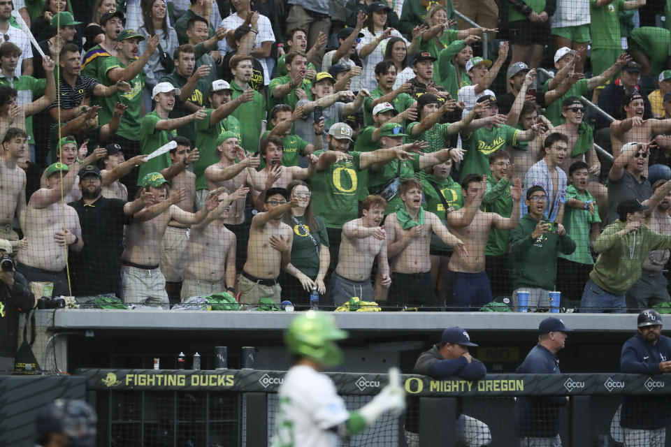 Oregon fans cheer during the ninth inning of the team's NCAA college baseball tournament super regional game against Oral Roberts on Friday, June 9, 2023, in Eugene, Ore. (AP Photo/Amanda Loman)