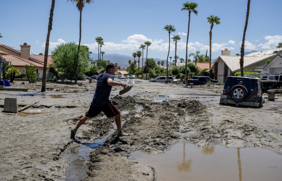 Ronald Mendiola walks barefoot through the mud