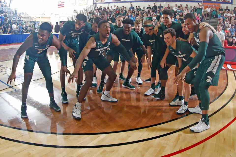 Michigan State huddles up before of the 75-62 win on Wednesday, Nov. 27, 2019, in Lahaina, Hawaii.
