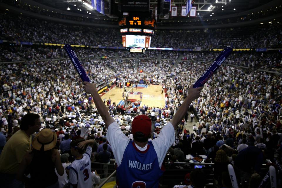 Fans erupt with joy during the fourth quarter of Game 4 between the Detroit Pistons and the Los Angeles Lakers in the NBA Finals Sunday, June 13, 2004, at the Palace of Auburn Hills in Auburn Hills, Mich.