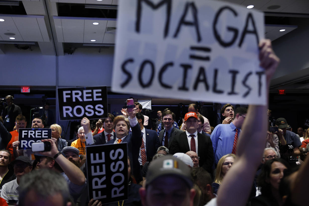 Supporters and critics of Trump cheer and jeer as he addresses the Libertarian national convention in Washington, D.C., on May 25.