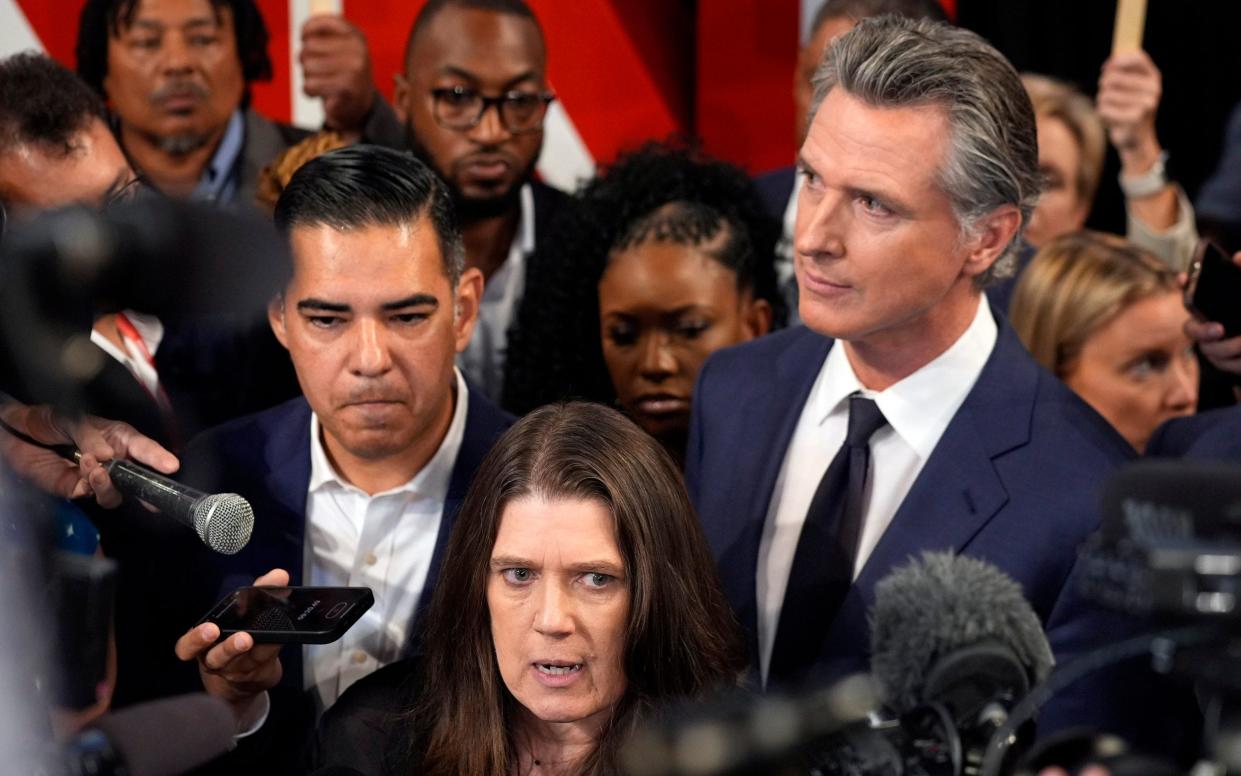 Gavin Newsom listens as Mary Trump, niece of Donald Trump, speaks following the presidential debate