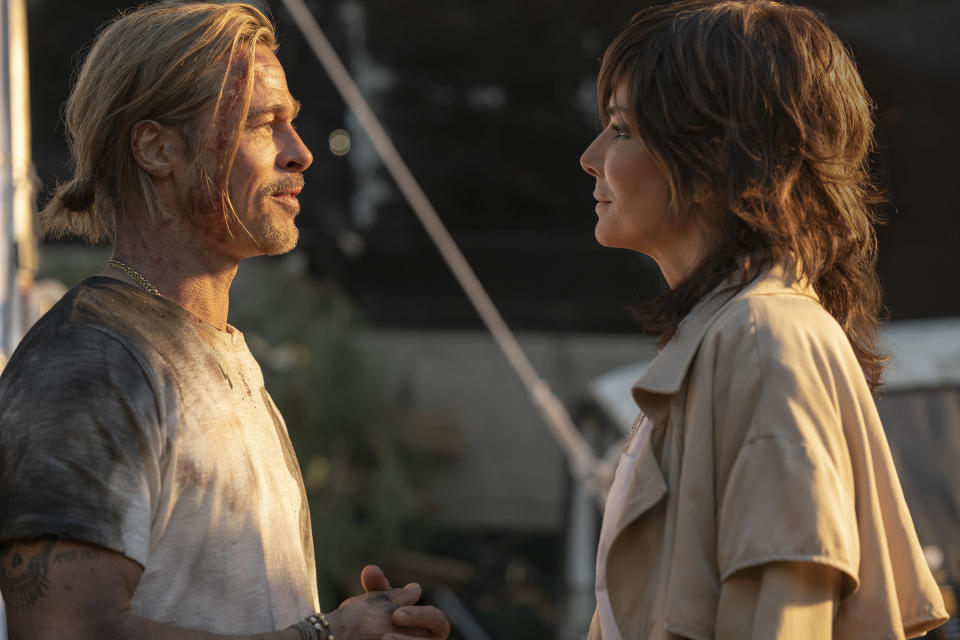 This image released by Sony Pictures shows Brad Pitt, left, and Sandra Bullock in a scene from "Bullet Train." Sony had the No. 2 movie with “Bullet Train,” which brought in an estimated $5.6 million in its fourth week, putting its domestic total past $78 million, according to studio estimates Sunday, Aug. 28, 2022. (Scott Garfield/Sony Pictures via AP)