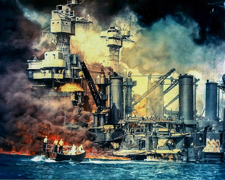 This December 7, 1941, photo from The National Archives shows the USS West Virginia burning after the surprise Japanese attack on Pearl Harbor, Hawaii.