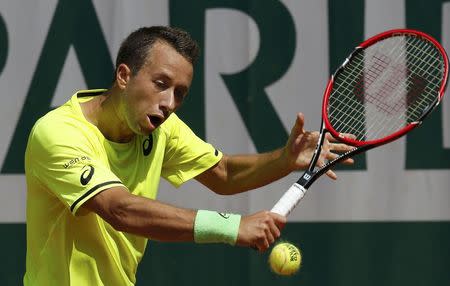 Philipp Kohlschreiber of Germany plays a shot to Go Soeda of Japan during their men's singles match at the French Open tennis tournament at the Roland Garros stadium in Paris, France, May 24, 2015. REUTERS/Pascal Rossignol