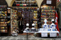 Face masks and gifts are on display at store in Prague, Czech Republic, Thursday, Dec. 3, 2020. A sign of normalcy has returned to the Czech Republic ahead of the Christmas period after the government eased some of its most restrictive measures imposed to contain the recent massive surge of coronavirus infections. On Thursday all stores, shopping malls, restaurants, bars and hotels were allowed to reopen. (AP Photo/Petr David Josek)