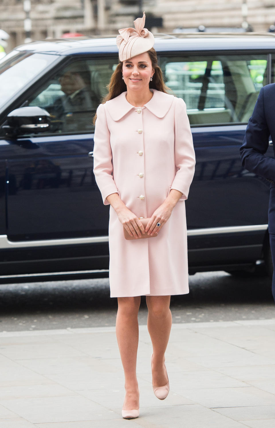 <p>Kate arrived at Westminster Abbey glowing in a pale pink Alexander McQueen coat and matching bow-adorned hat. (Photo: PA) </p>