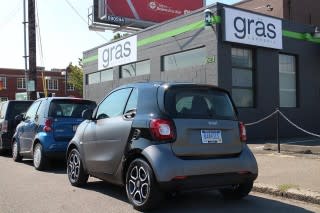 2016 Smart ForTwo minicar, parked behind first-generation model, Portland, Oregon, Aug 2015