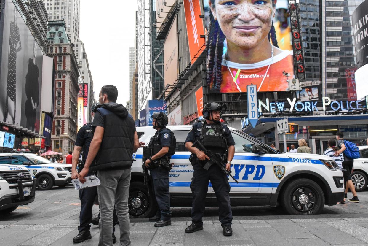 Members of the New York City Police Counterterrorism force stand guard in Times Square: Stephanie Keith/Getty Images
