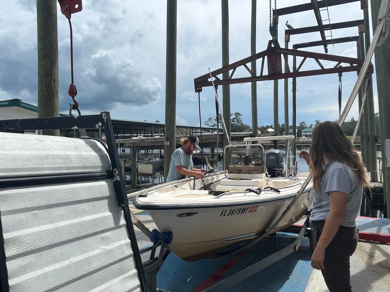 Natalie Futch and Matt Alexander prepare to remove their boat from the docks of Steinhatchee River Inn and Marina and bring it home with them to Cross City on Aug. 29, 2023. .