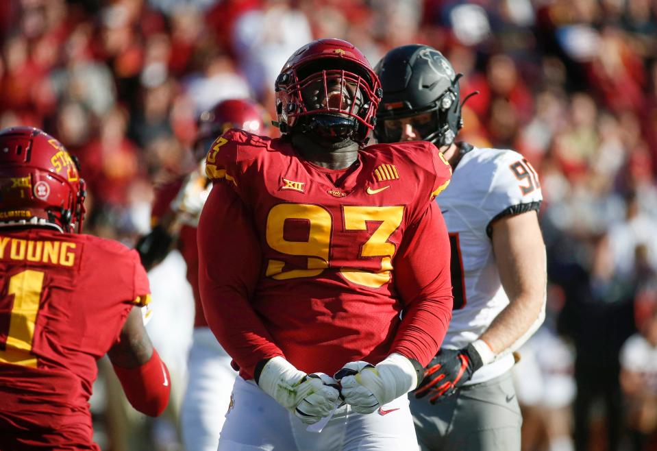 Iowa State junior defensive tackle Isaiah Lee reacts after stopping Oklahoma State senior running back Jaylen Warren in the backfield for a loss of yards in the second quarter on Saturday, Oct. 23, 2021, at Jack Trice Stadium in Ames.