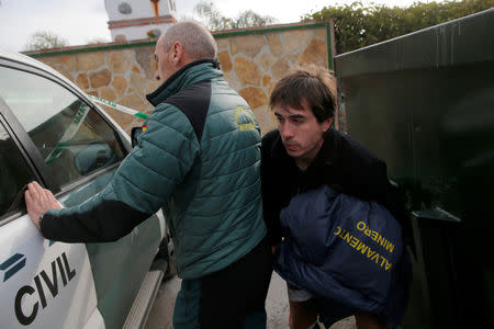 A member (R) of the miner rescue team leaves the control center towards the area where Julen, a Spanish two-year-old boy, fell into a deep well nine days ago when the family was taking a stroll through a private estate, in Totalan, southern Spain January 22, 2019. REUTERS/Jon Nazca