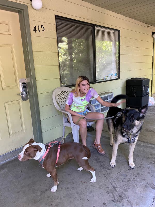Katrina Mulvaney, plays with her dogs in Nevada City